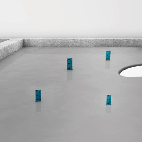 Four blue rectangular objects on a gray floor with white walls