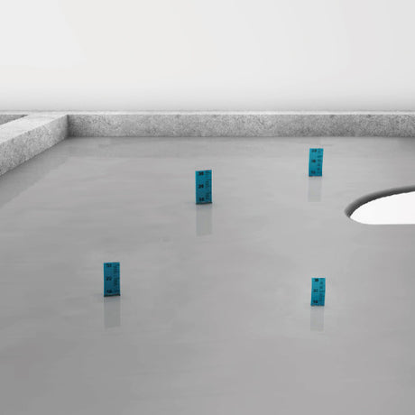 Four blue rectangular objects on a gray floor with white walls